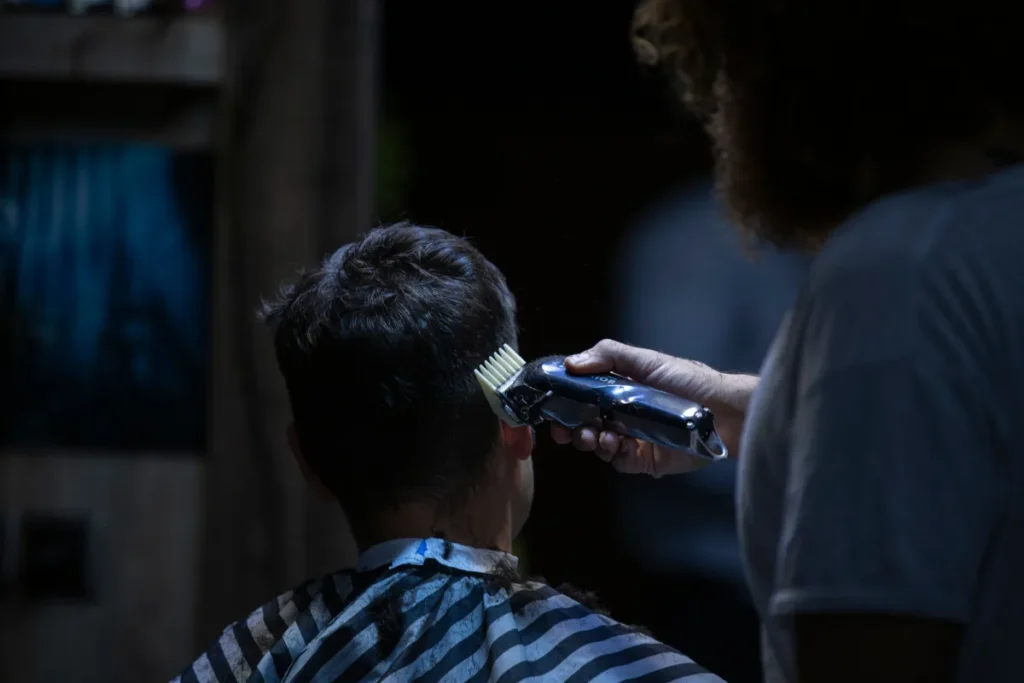 Back of a short haircut being blended with clippers